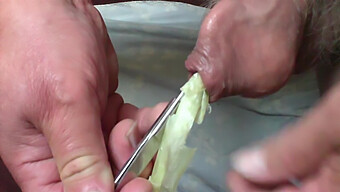 Watch As A Man Uses Both A Spring Onion And Scissors To Expand His Foreskin